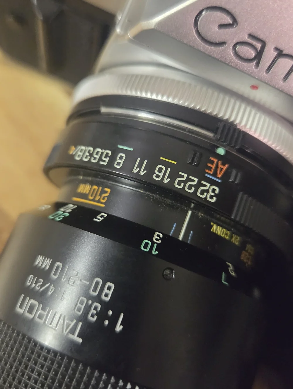 Canon Silver SLR Camera with Black Tamron 80-210mm Lens